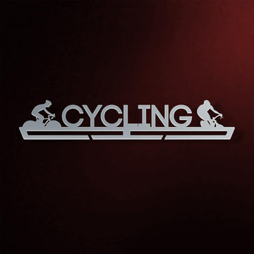 Cycling Medal Hanger in laser-cut steel on a dark background