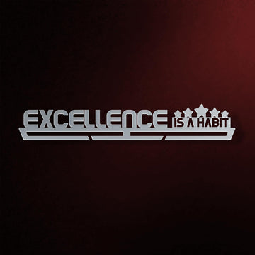 Excellence Is A Habit Medal Hanger in laser-cut steel on a dark background