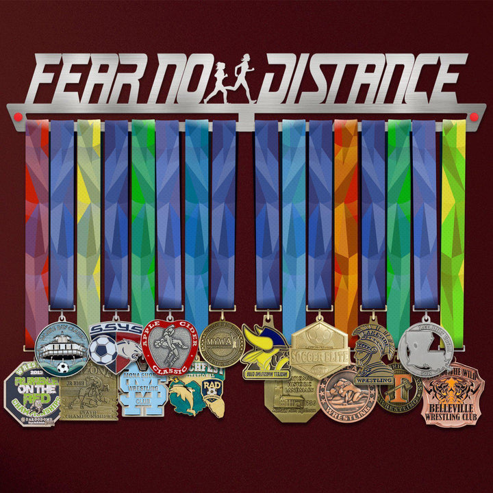 Women's Fear No Distance Medal Hanger holding a full row of medals on a wall
