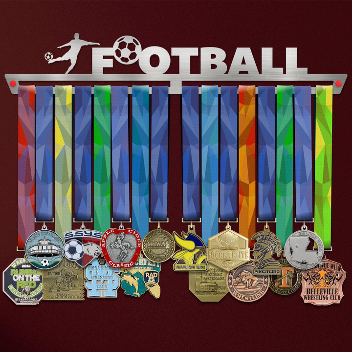 Football Medal Hanger holding a full row of medals on a wall