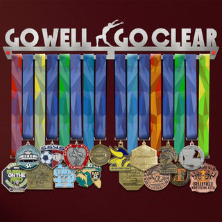 Go Well Go Clear Medal Hanger holding a full row of medals on a wall