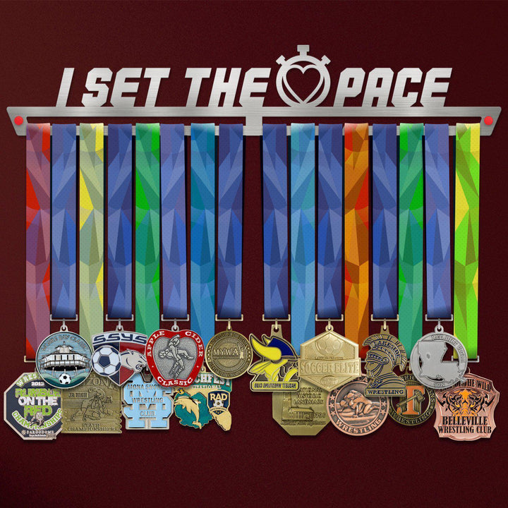 I Set The Pace Medal Hanger holding a full row of medals on a wall