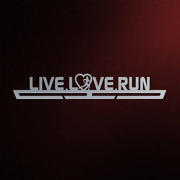 Women's Live Love Run Medal Hanger in laser-cut steel on a dark background