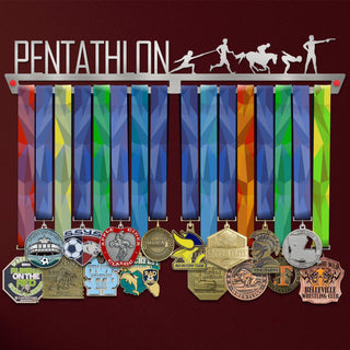 Pentathlon Medal Hanger holding a full row of medals on a wall