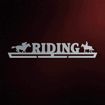 Horse Riding Medal Hanger in laser-cut steel on a dark background
