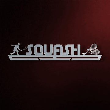 Squash Medal Hanger in laser-cut steel on a dark background